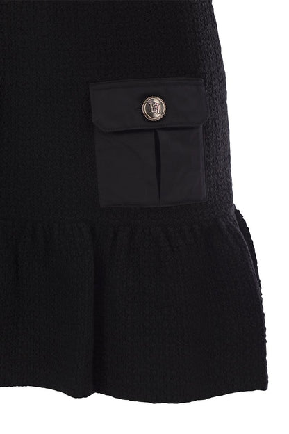 Bouclé wool miniskirt with technical sail cloth pockets