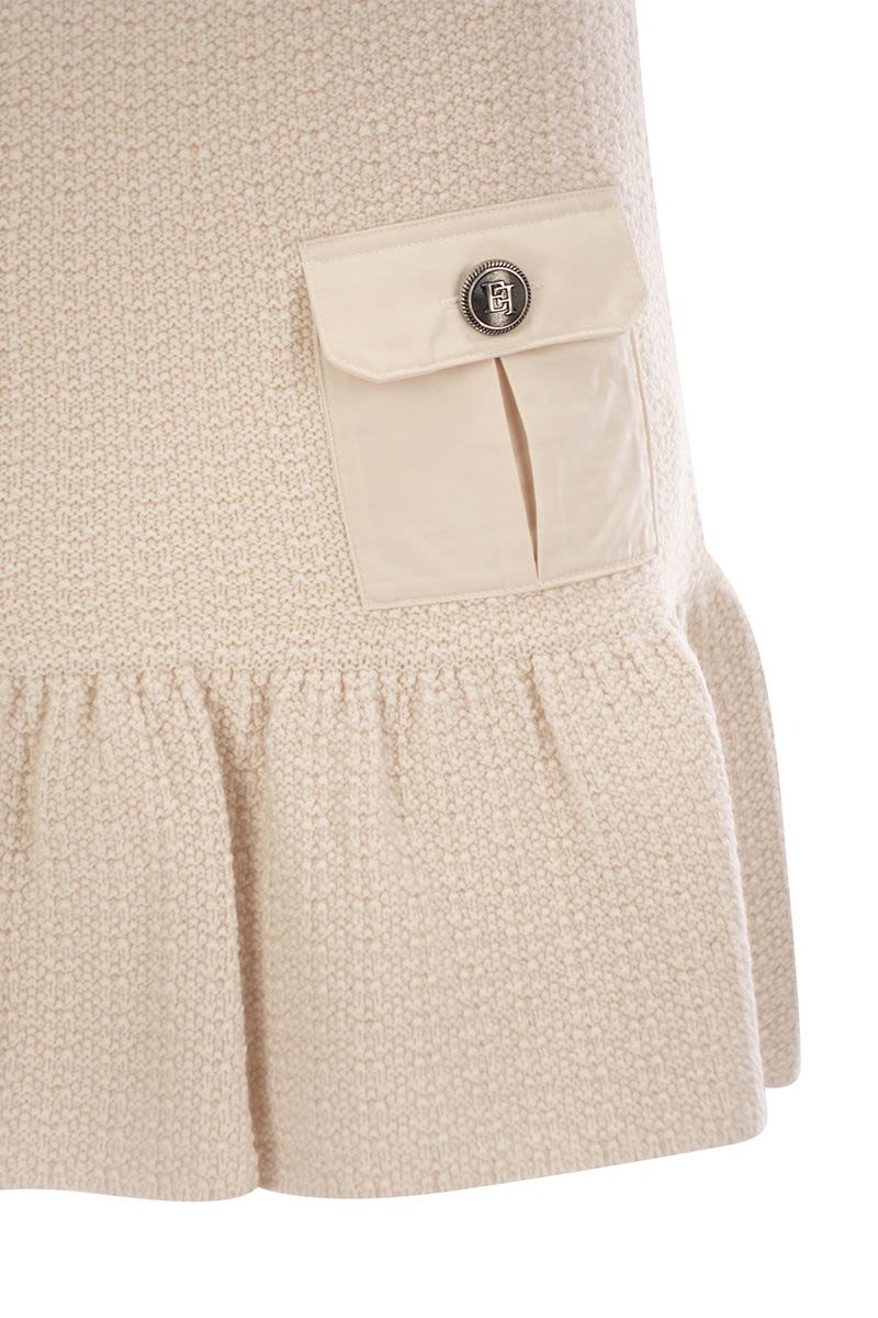 Bouclé wool miniskirt with technical sail cloth pockets