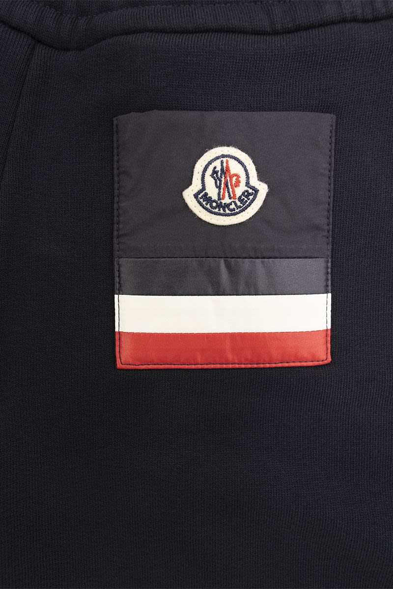 Sports trousers with tricolour pocket