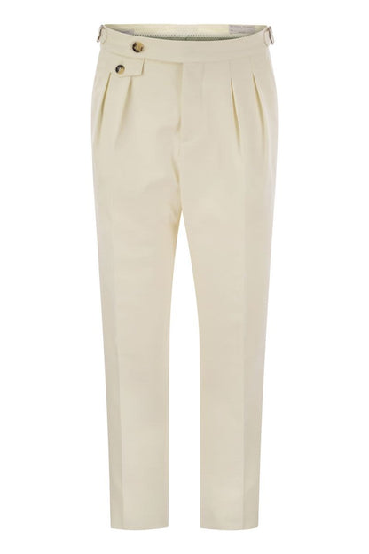 Tailor-fit trousers in cotton gabardine and virgin wool with double inverted darts and buckles on the side