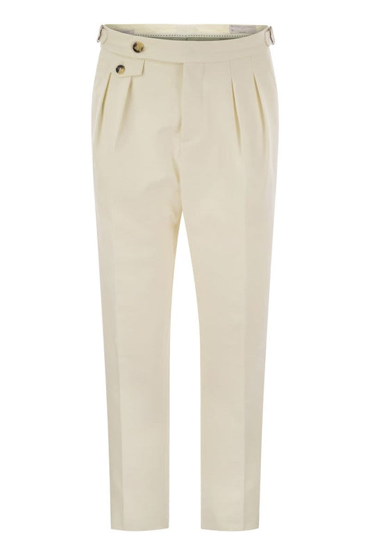 Tailor-fit trousers in cotton gabardine and virgin wool with double inverted darts and buckles on the side