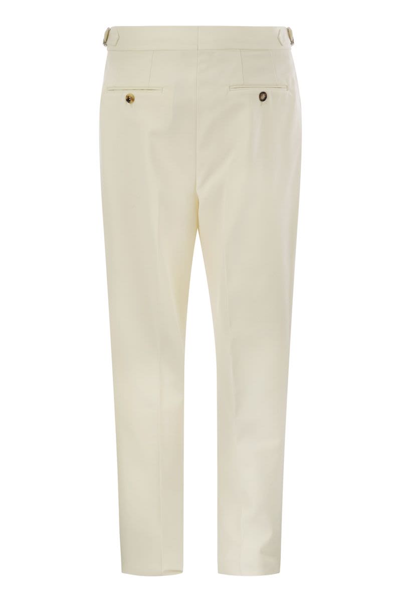 Tailor-fit trousers in cotton gabardine and virgin wool with double inverted darts and buckles on the side