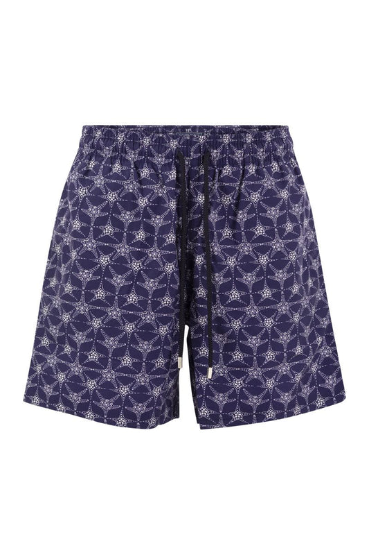 Star patterned beach shorts