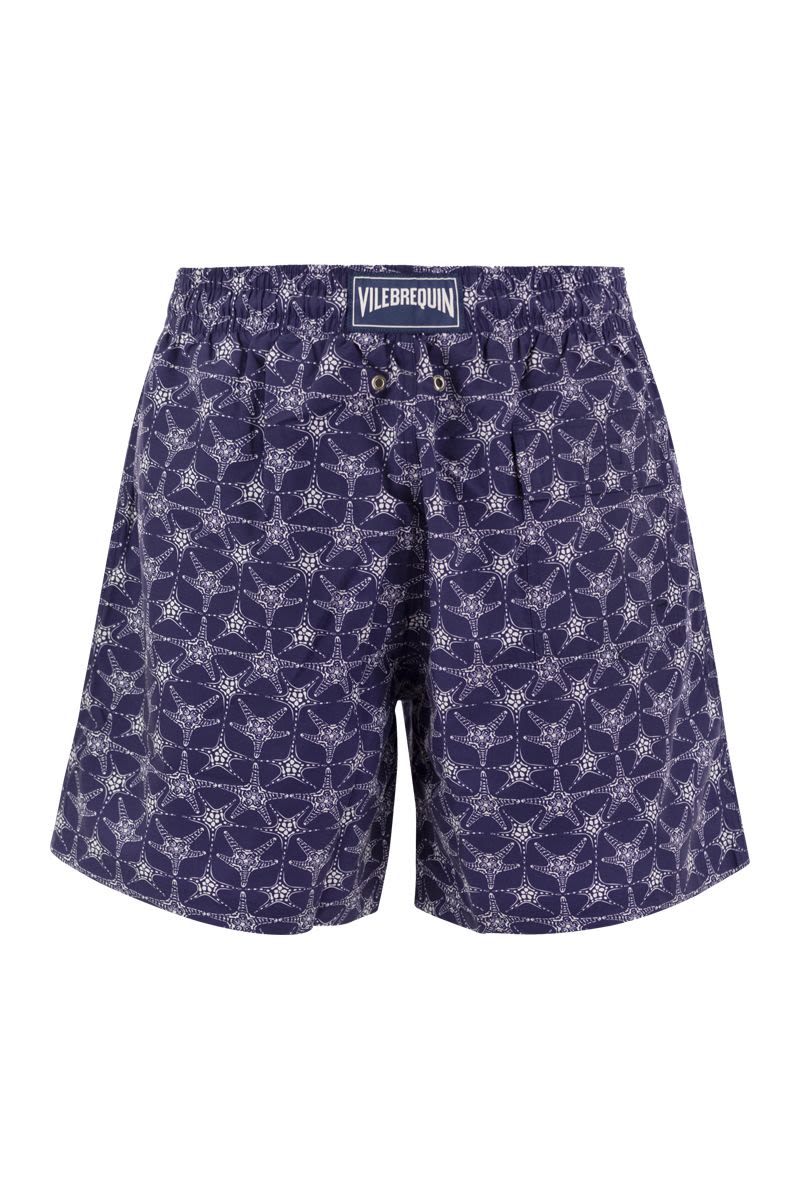 Star patterned beach shorts