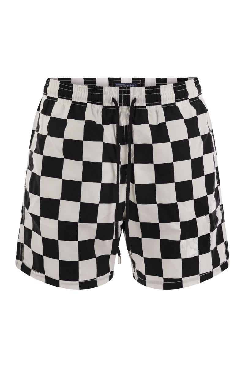 Swim shorts with checkered pattern