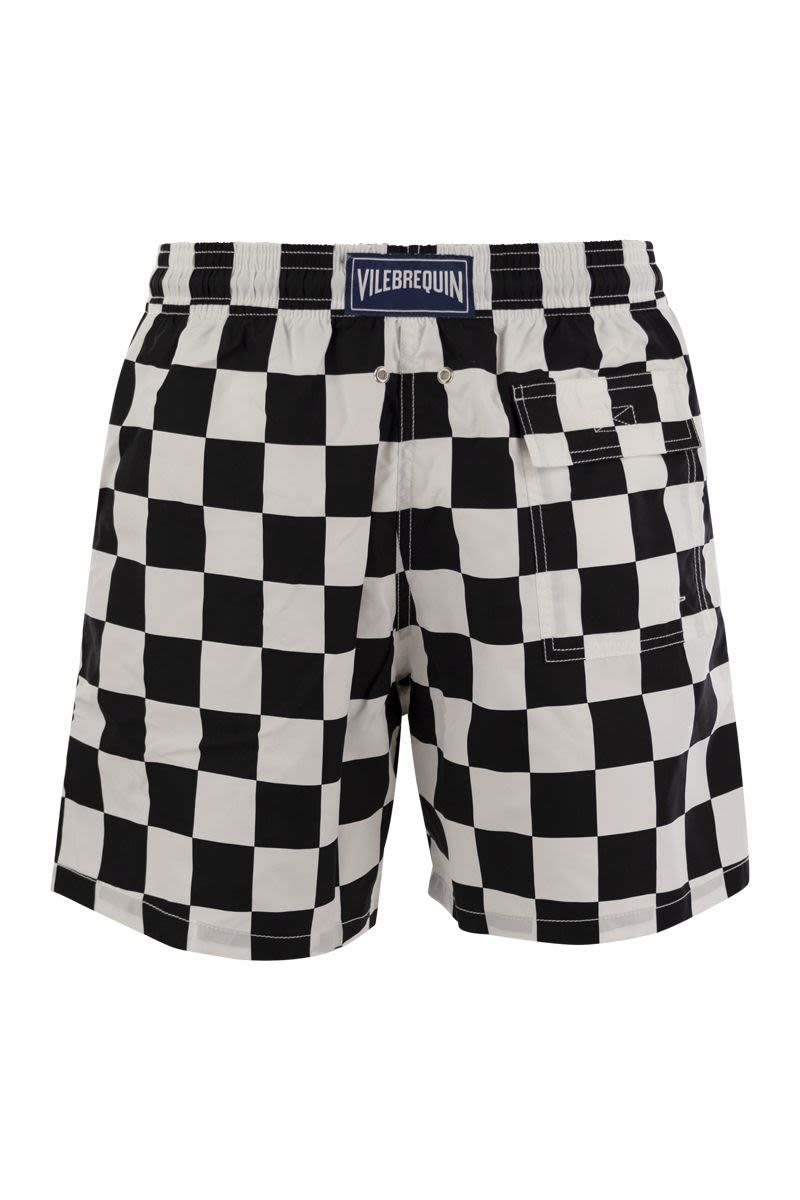 Swim shorts with checkered pattern