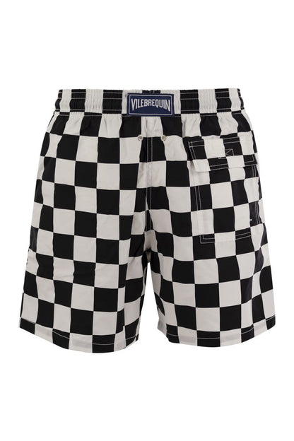 Swim shorts with checkered pattern