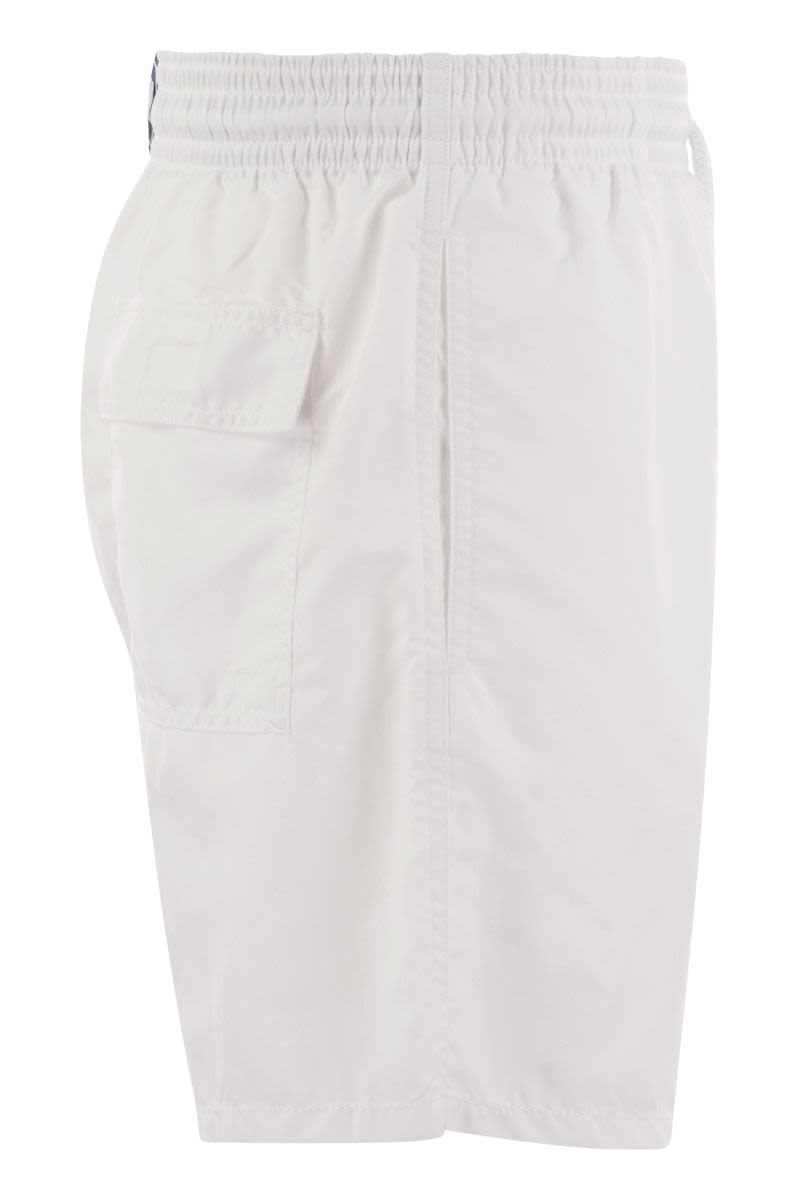 Plain-coloured beach shorts