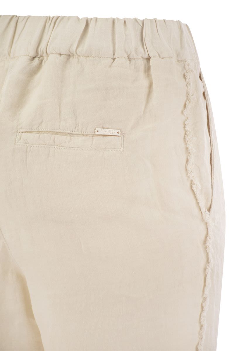 Linen trousers with side fringes