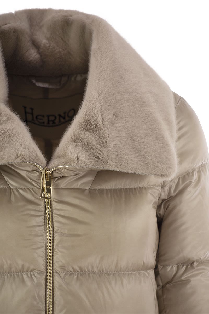 Down jacket with cruelty-free fur details