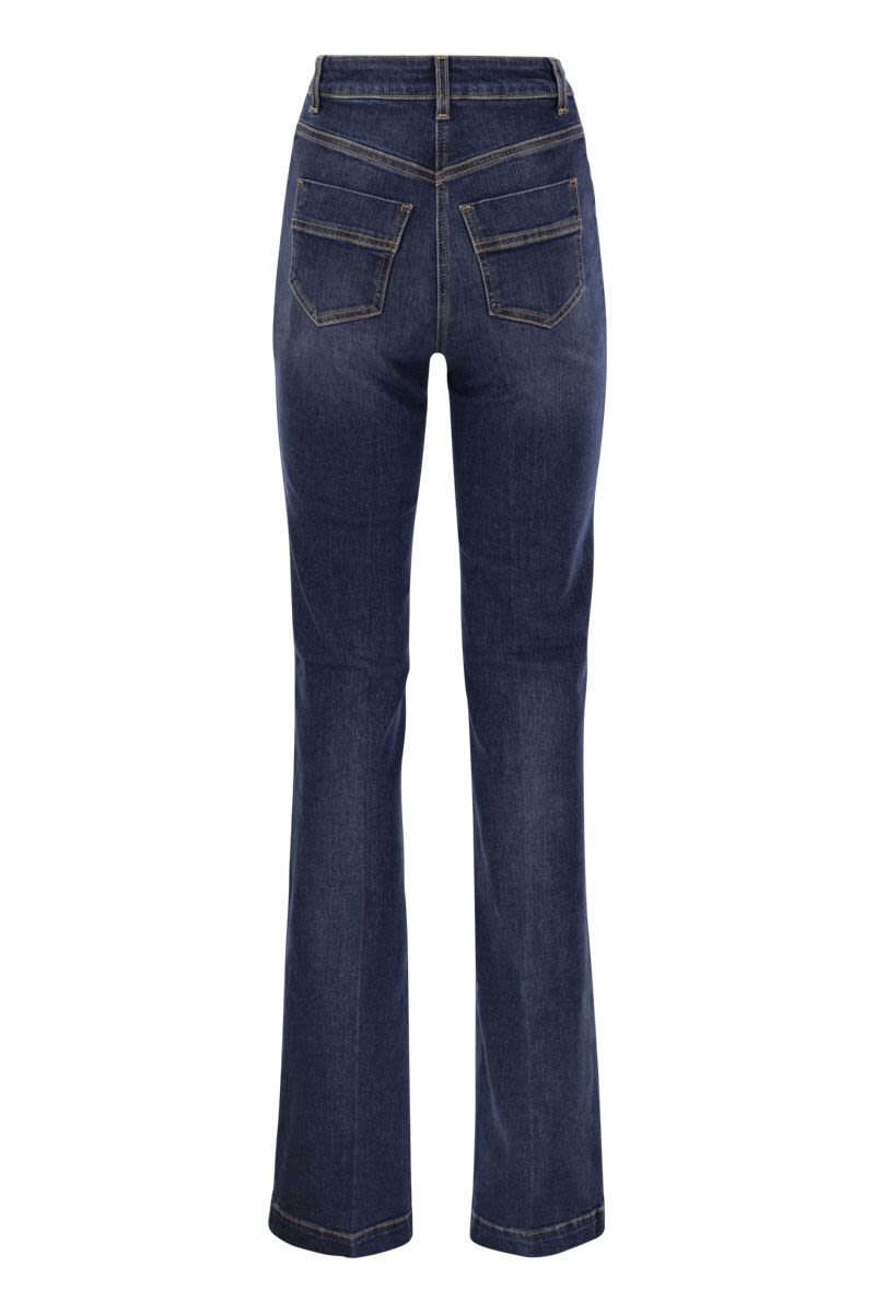 Stretch cotton flared jeans with side button fastening