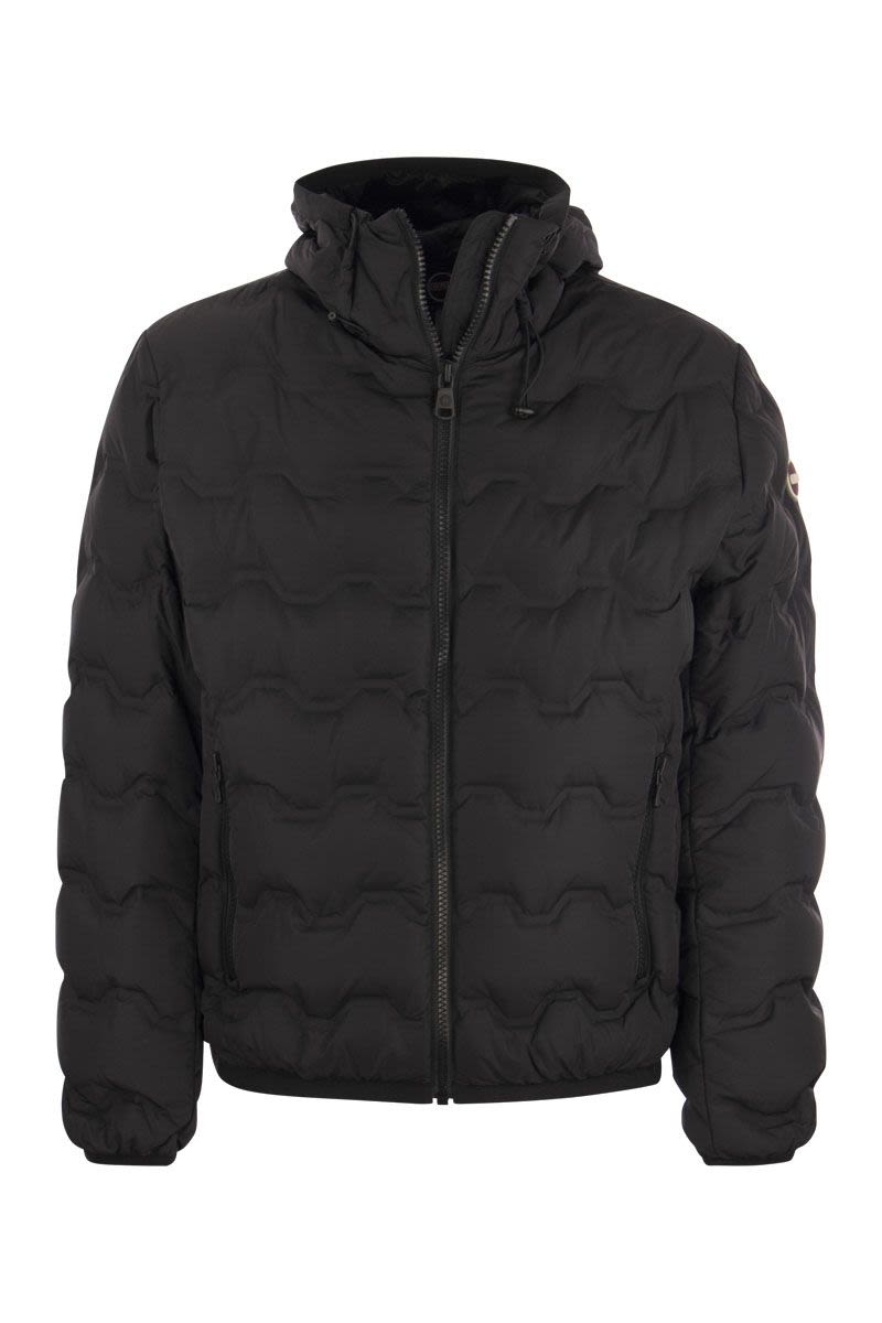 UNCOMMON - Quilted down jacket with hood - VOGUERINI