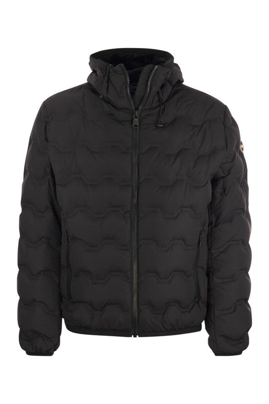 UNCOMMON - Quilted down jacket with hood - VOGUERINI