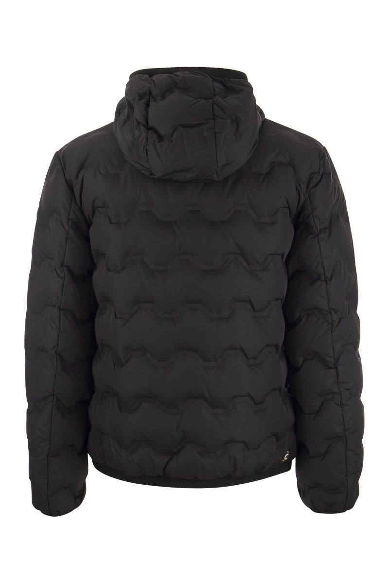 UNCOMMON - Quilted down jacket with hood - VOGUERINI