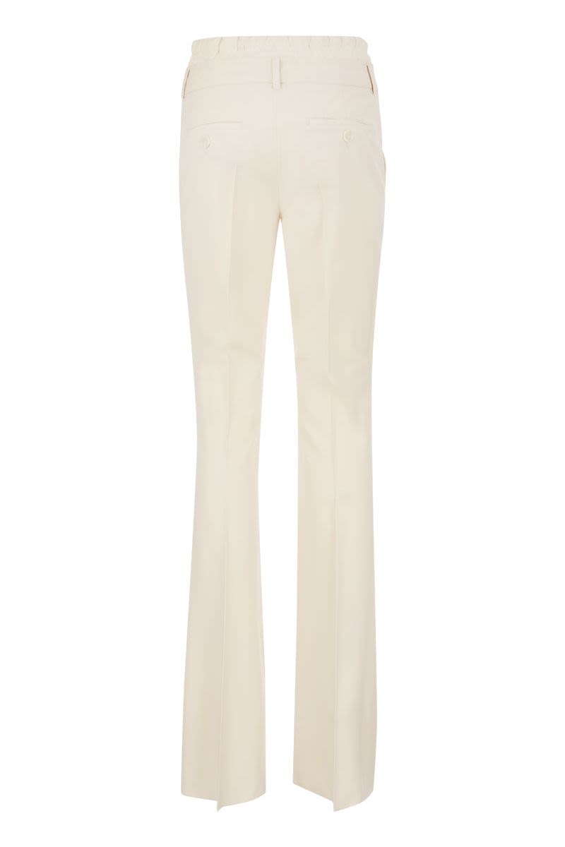 NILLY - Flare pants with double waistband - VOGUERINI