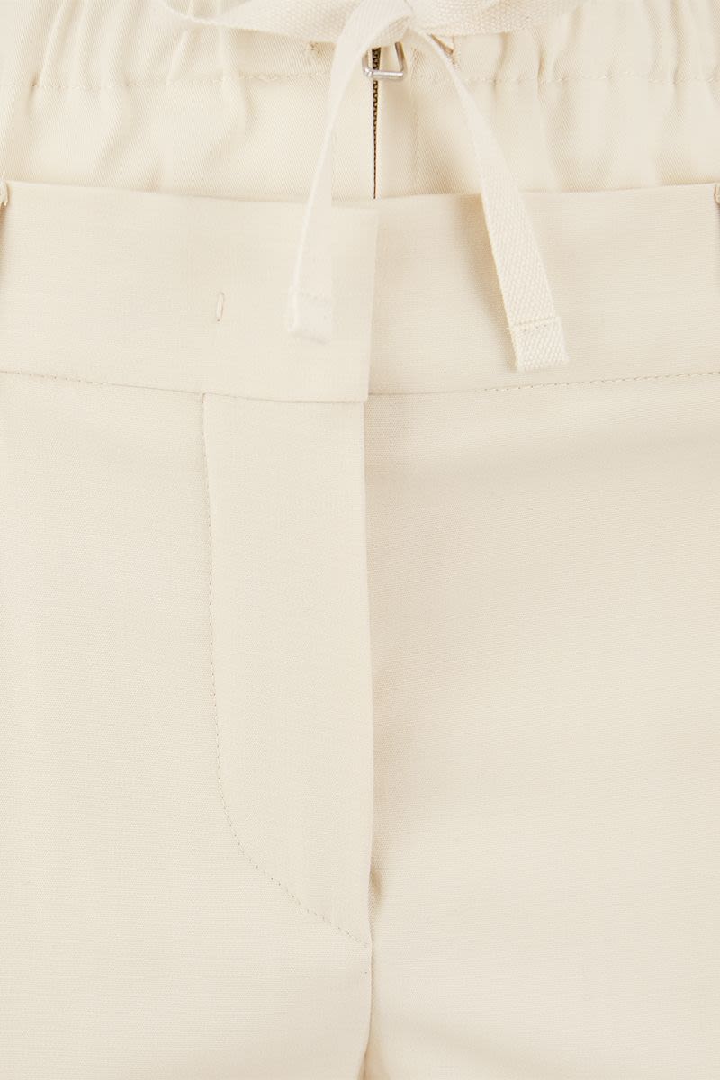 NILLY - Flare pants with double waistband - VOGUERINI