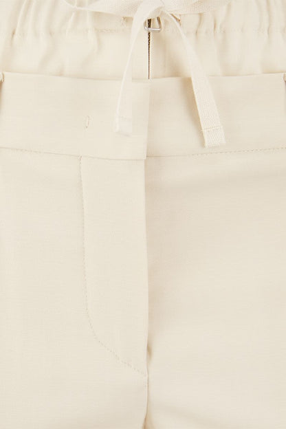 NILLY - Flare pants with double waistband - VOGUERINI