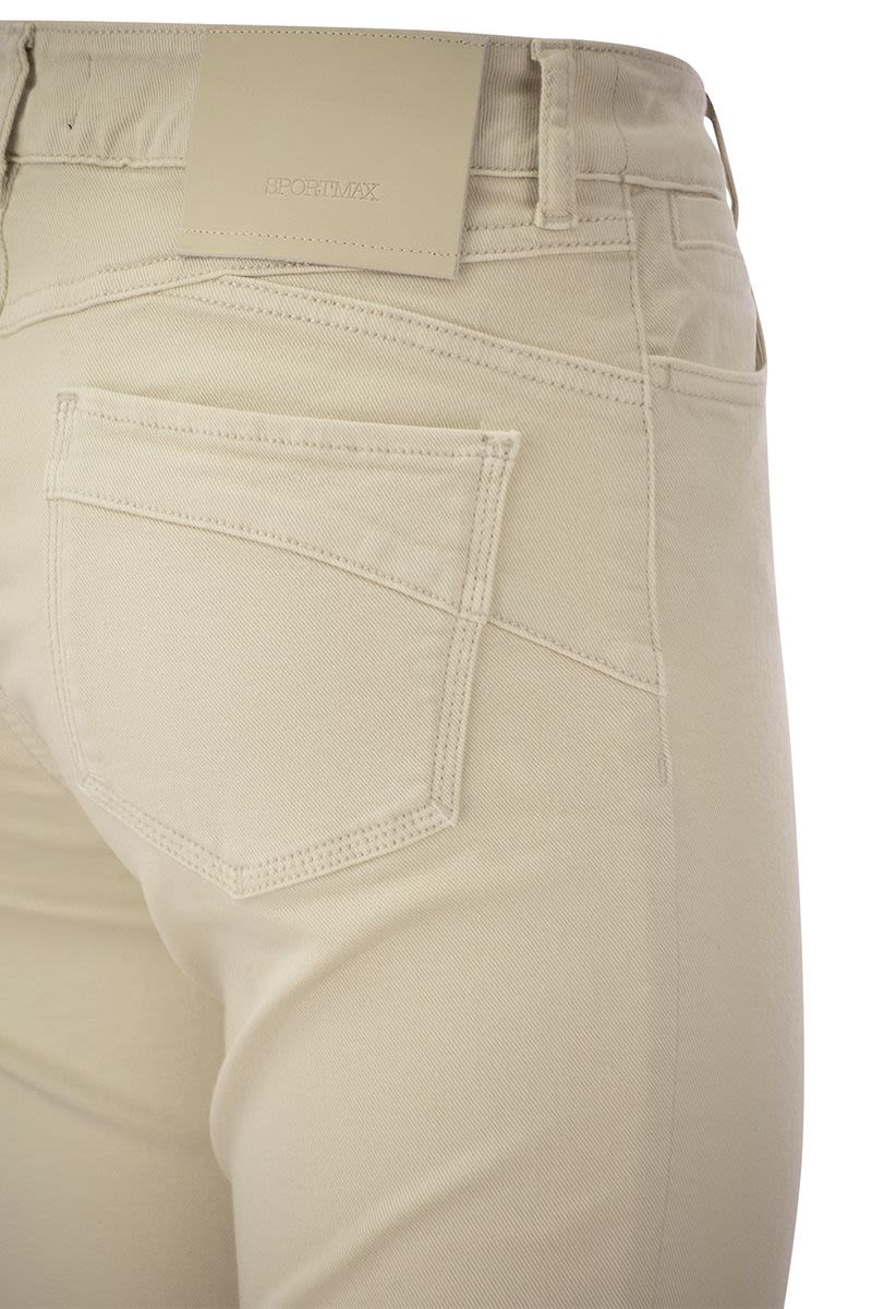 NILLY - Five-pocket mini flare trousers - VOGUERINI