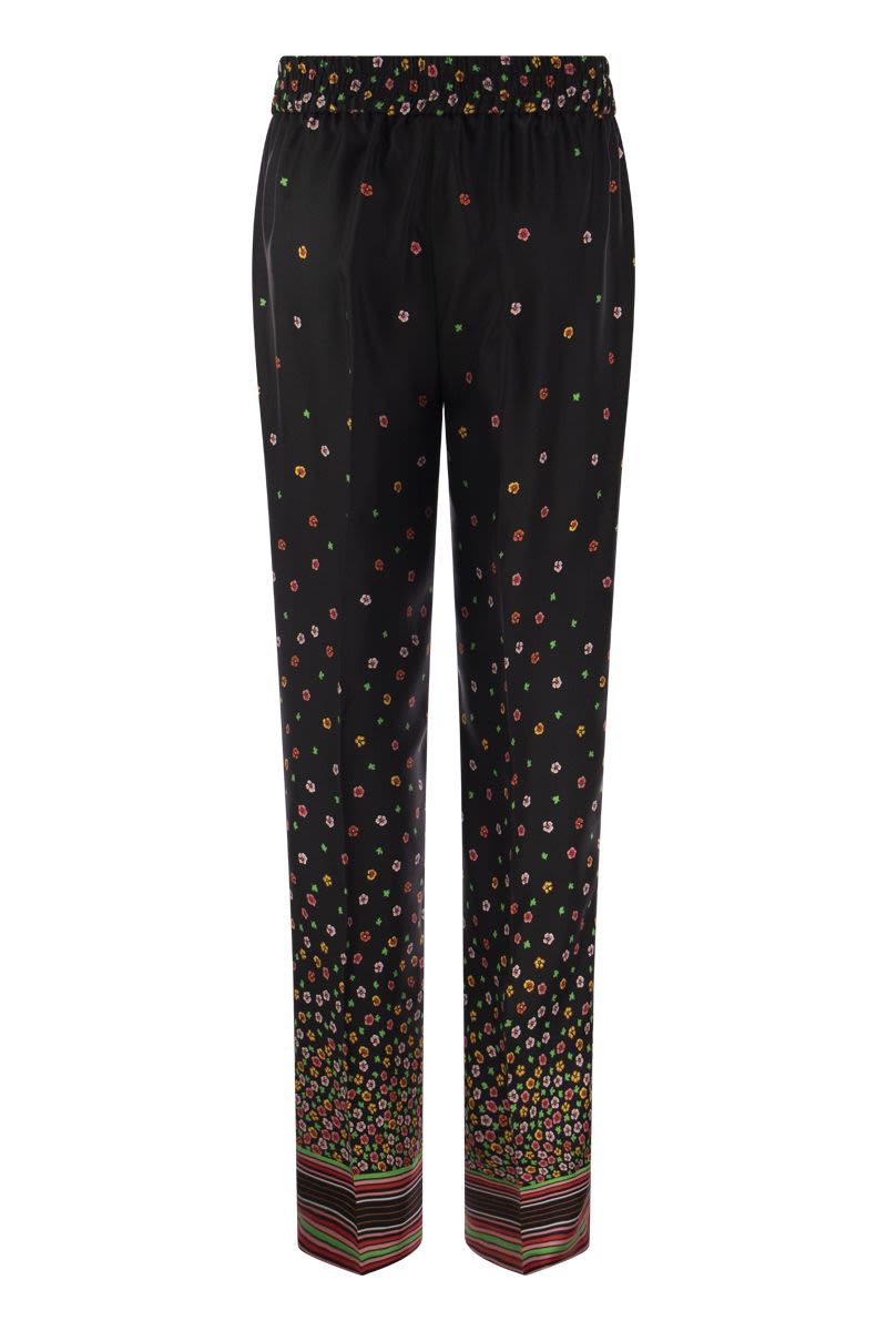 Floral print silk trousers - VOGUERINI