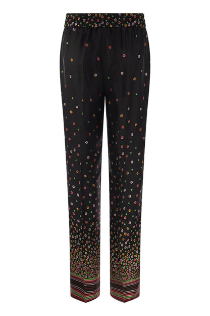 Floral print silk trousers - VOGUERINI