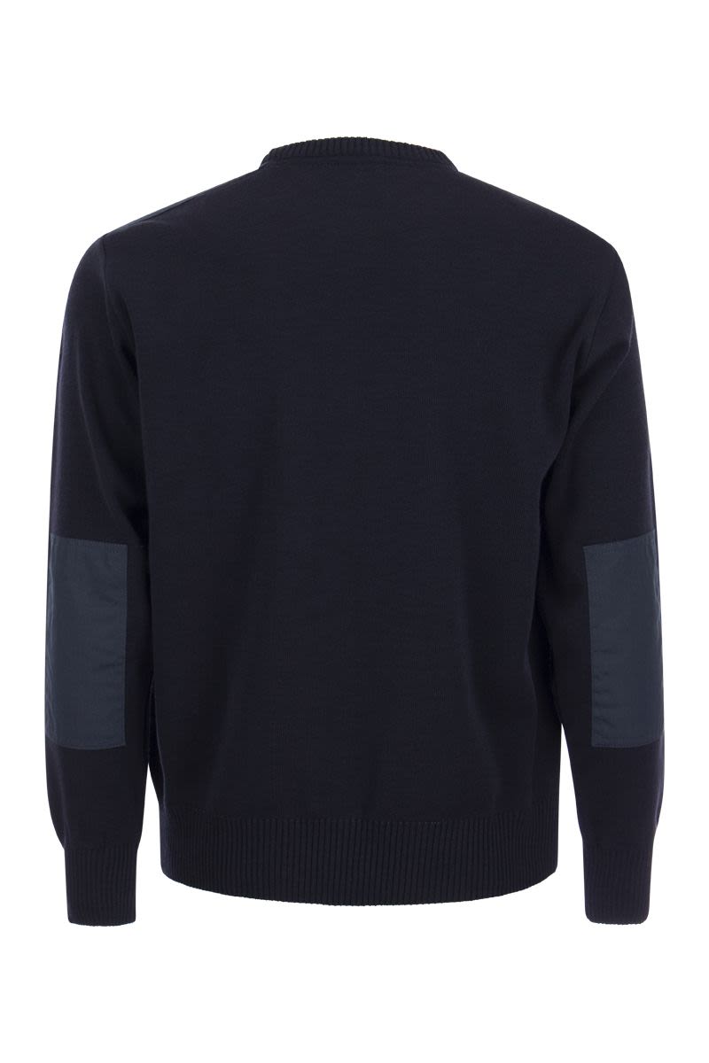 Wool crew neck with iconic badge - VOGUERINI