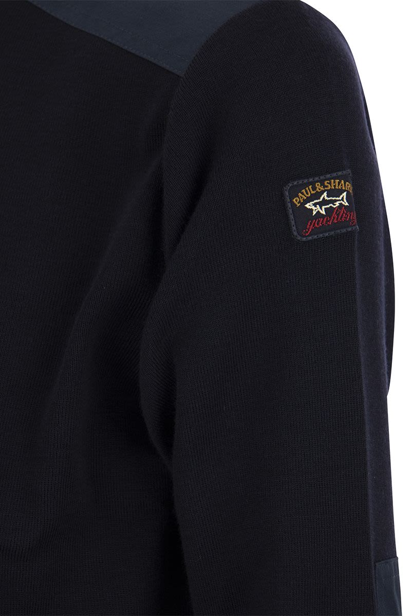 Wool crew neck with iconic badge - VOGUERINI