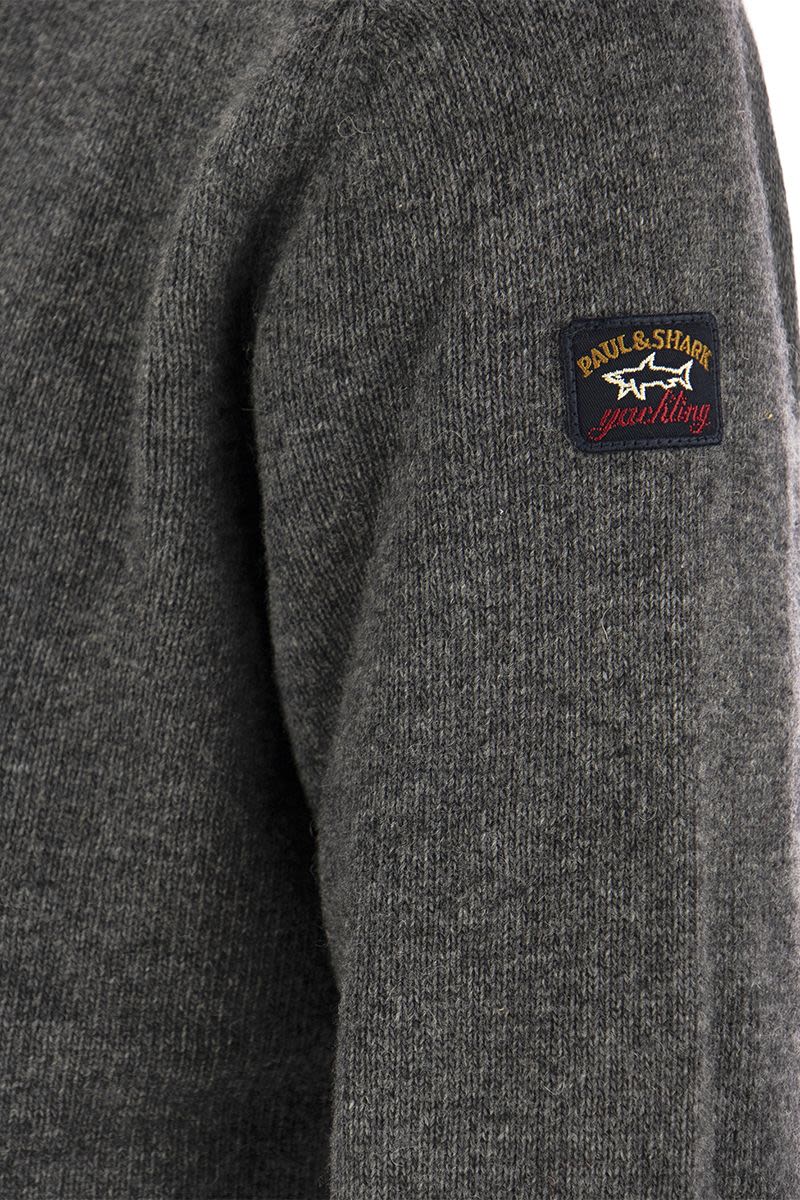 Wool crew neck with arm patch - VOGUERINI