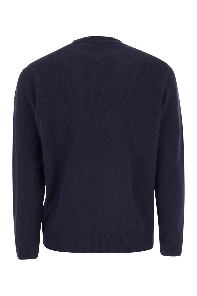 Wool crew neck with arm patch - VOGUERINI