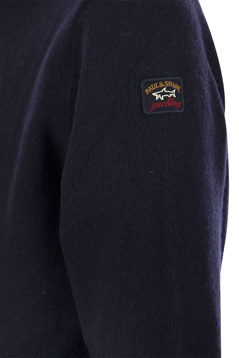 Wool crew neck with arm patch - VOGUERINI