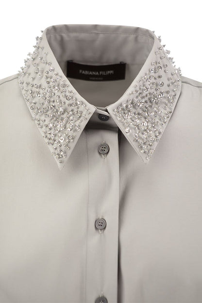 Sleeveless shirt with belt - VOGUERINI