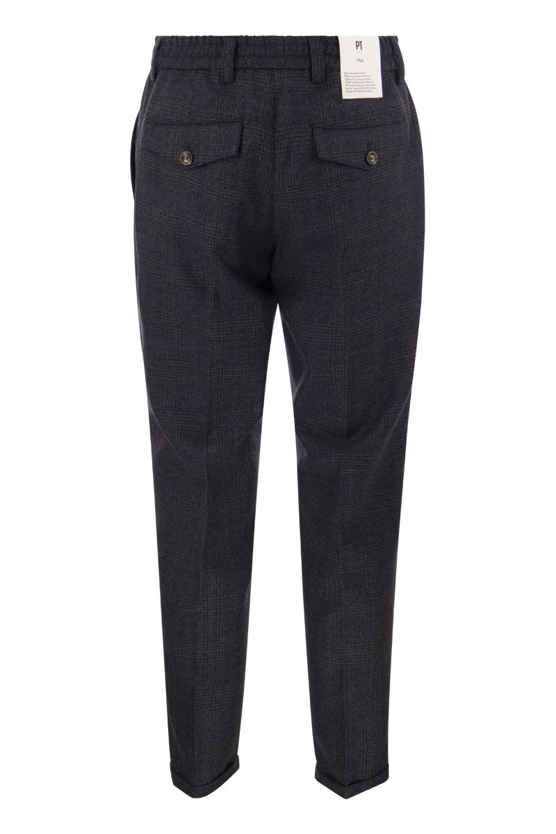 REBEL - Pure virgin wool trousers - VOGUERINI