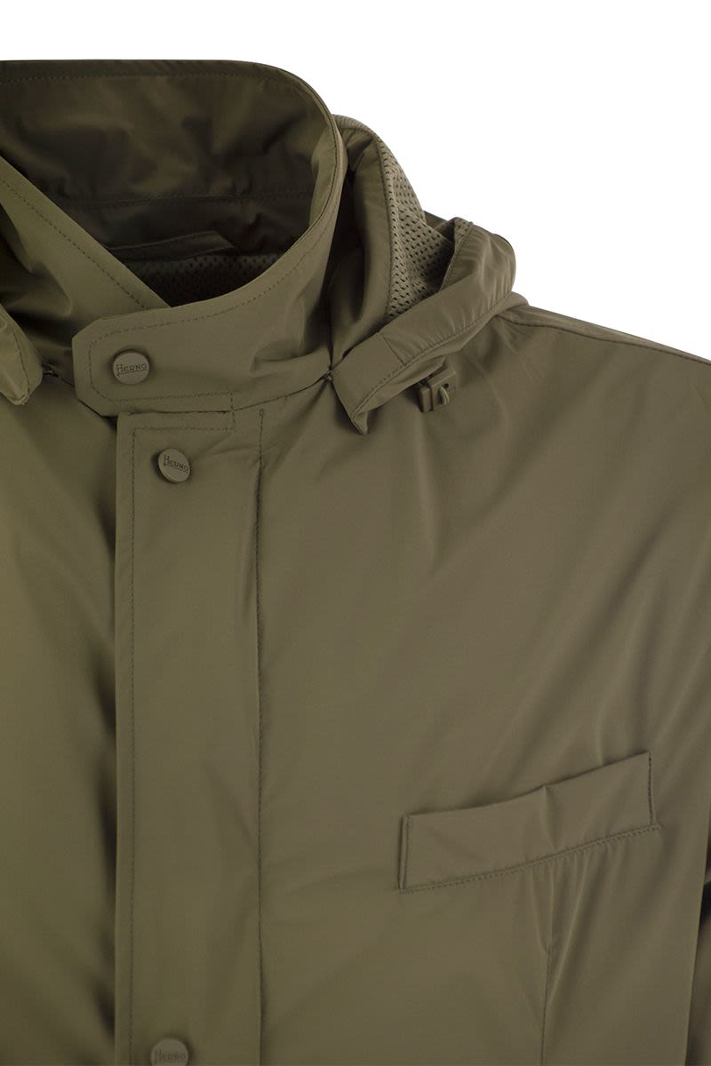 Technical fabric jacket with hood