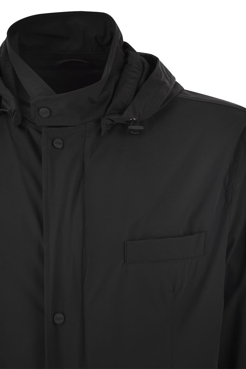 Technical fabric jacket with hood