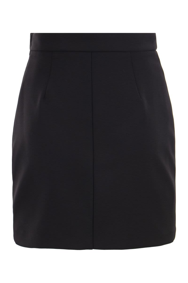 Crepe miniskirt with logo plaques - VOGUERINI