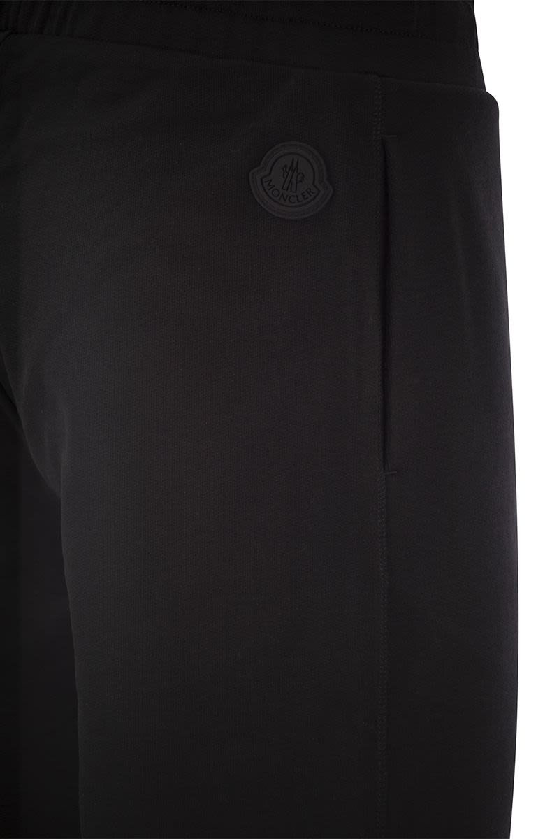 Logo-embossed sports trousers - VOGUERINI