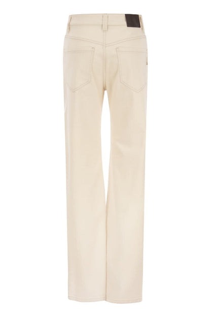 Loose trousers in garment-dyed comfort denim with Shiny Tab - VOGUERINI