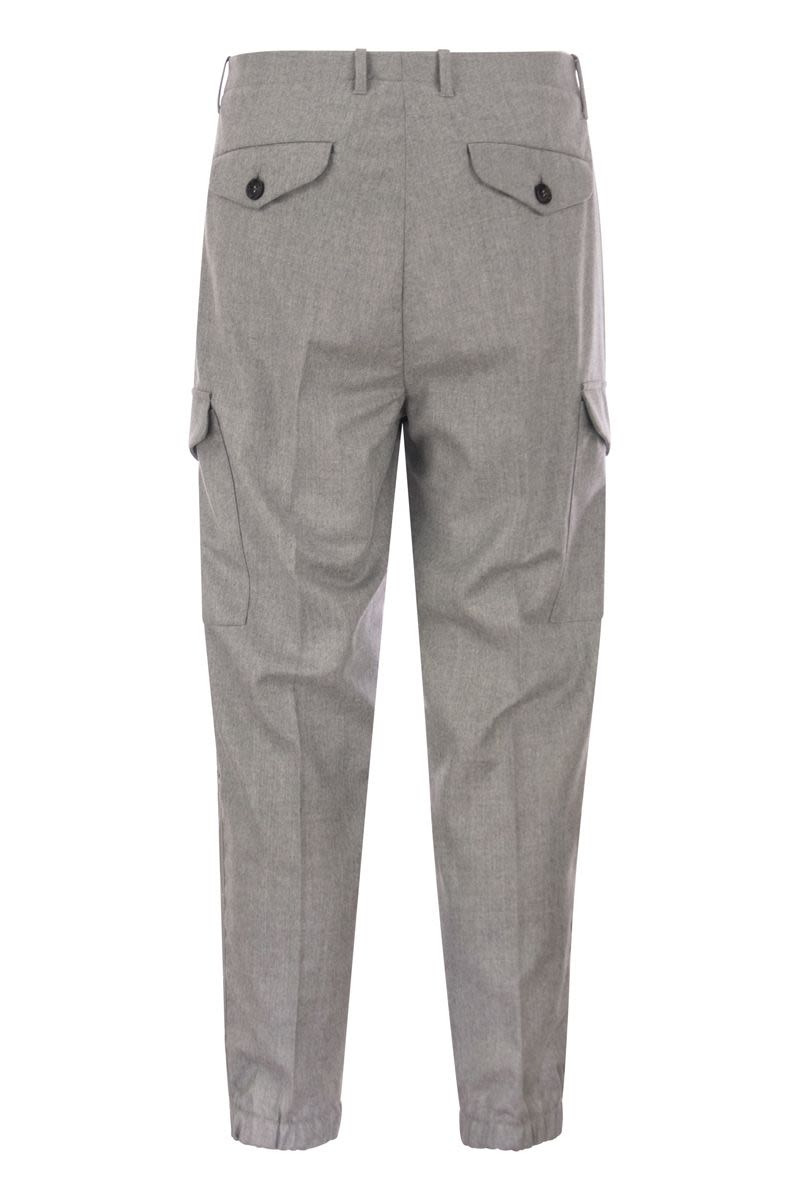 Virgin wool trousers with cargo pockets and bottom zip - VOGUERINI