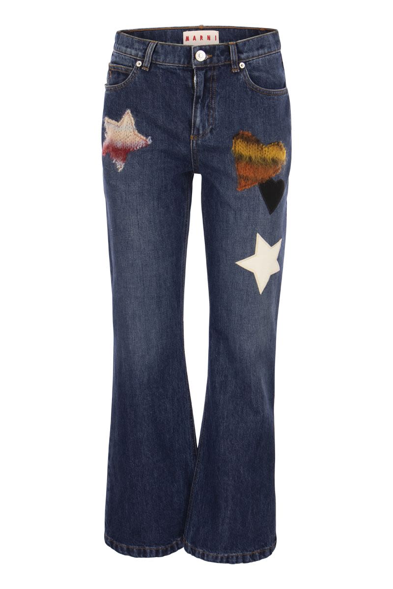 Denim flare trousers with knitted appliqués - VOGUERINI