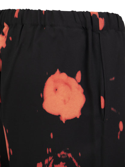 Trousers with Faded Roses print - VOGUERINI