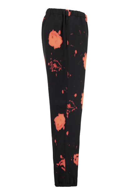 Trousers with Faded Roses print - VOGUERINI