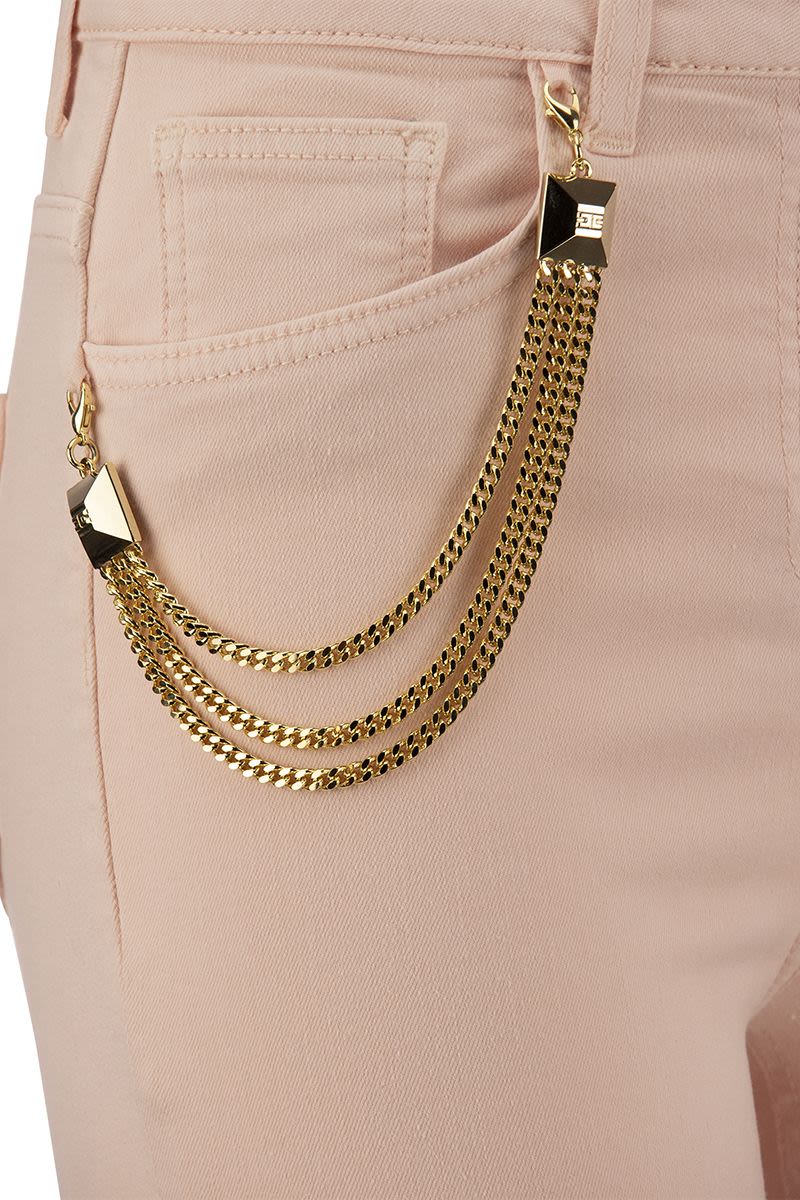 Skinny jeans with chain and stud charm - VOGUERINI